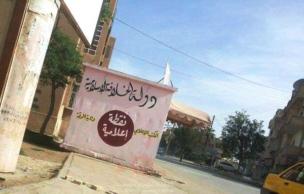 A sign announces the presence of an 'Islamic State of Iraq and the Levant' media centre, which distributes the group’s publications, leaflets and CDs to al-Raqa residents. [Photo courtesy of al-Raqa is Being Slaughtered Silently]