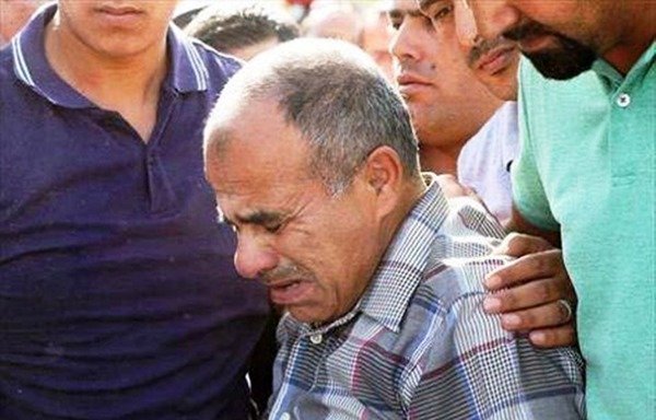 The father of Omar Hiari, one of the five Jordanian security personnel killed on June 6th, mourns the death of his son. [Photo from the General Intelligence Department Facebook page]
