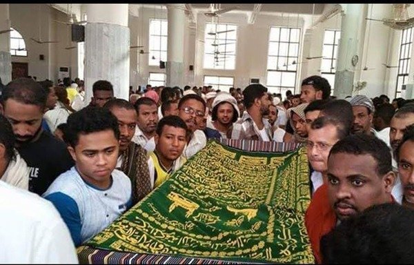 Residents of the southern city of al-Mukalla attend a funeral for the victims of a series of June 27th suicide attacks claimed by the 'Islamic State of Iraq and the Levant'. [Photo courtesy of almukallanow Twitter account]