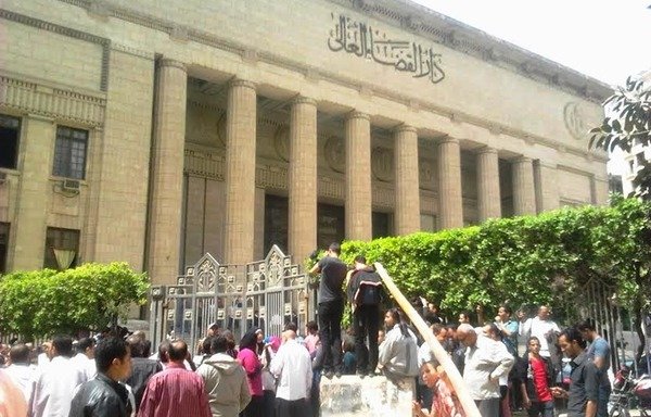 Egyptians gather outside the High Court of Justice in Cairo. Egyptian courtrooms are currently trying a number of defendants on terrorism charges. [Waleed Abu al-Khair/Al-Mashareq]