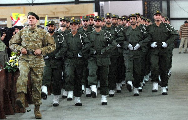 Fighters from Iran-backed Hizbullah march in a military parade in Beirut. [Al-Mashareq]