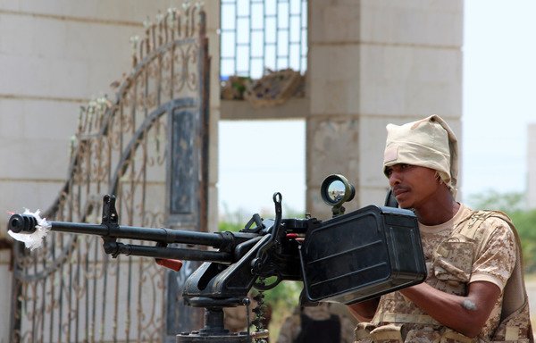 A Yemeni soldier stands in the back of an armoured vehicle in Zinjibar on August 16th after entering the Abyan provincial capital to recapture it from al-Qaeda. [Saleh al-Obeidi/AFP]