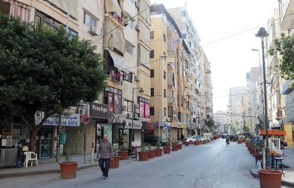 A man walks down Mouawad street in a southern suburb of Beirut. A number of Houthi families now reside in the neighbourhood, which is a stronghold of Hizbullah. [Al-Mashareq]