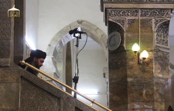 'Islamic State of Iraq and the Levant' leader Abu Bakr al-Baghdadi announces the creation of his so-called caliphate in this screen shot from a June 2014 video. The ISIL leader is in hiding and seldom shows his face.