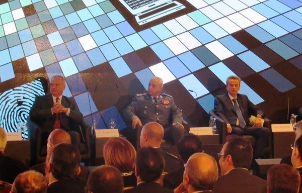Lebanon’s Central Bank Governor Riad Salameh (right) and security officials take part in the 2nd annual Anti-Cybercrime Forum held November 29th in Beirut. [Junaid Salman/Al-Mashareq]