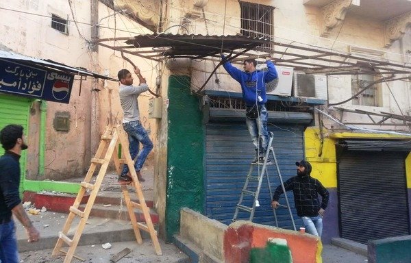 Young men from Lebanon’s Tripoli take part in rehabilitation work in a city neighbourhood. [Photo courtesy of The One Voice Team]