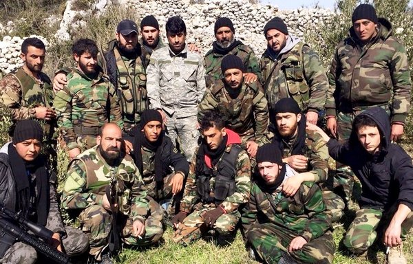 Iraqi fighters from Abu al-Fadl al-Abbas Brigade pose for a photograph in Syria. [Photo courtesy of Mohammed al-Abdullah]