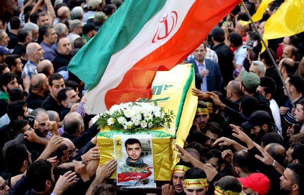 Members and supporters of Lebanon's Hizbullah carry the coffin of Jalal al-Effeh, killed in combat in Syria alongside regime forces, during an October 2016 funeral procession in a southern suburb of Beirut. Iran has extended its influence in Syria by arming and equipping groups such as Hizbullah in violation of international agreements. [Anwar Amro/AFP]