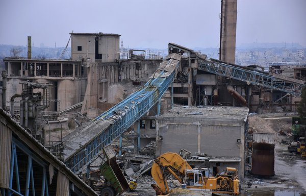 A general view shows a cement factory in Aleppo's Sheikh Saeed district on January 31st as engineering specialists tour the factory to analyse how to fix the damage and start reproducing cement to rebuild the eastern part of Aleppo. [George Ourfalian/AFP]
