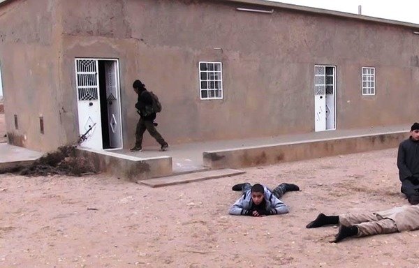 Members of the Syrian Democratic Forces arrest children fighting in the ranks of the 'Islamic State of Iraq and the Levant' during battles in upper al-Raqa province. [Photo courtesy of the Syrian Democratic Forces]