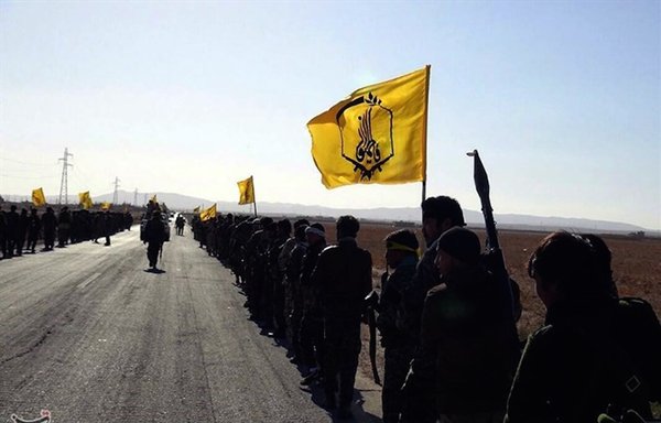 The Fatemiyoun Brigade, an Afghan Shia militia fighting under the command of Iranian officers, fought alongside pro-Syrian government troops in Palmyra, Syria, in December. [Tasnim News Agency]