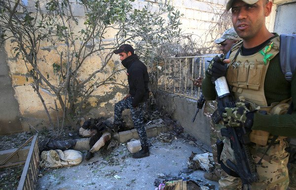 Iraqi security forces are seen here in the village of al-Buseif, south of Mosul, during an offensive to retake the western side of the city from the 'Islamic State of Iraq and the Levant' on February 21, 2017. Iraqi forces have managed to take over several locations the group had used to broadcast its propaganda and publish its magazines and other material. [Ahamd al-Rubaye/AFP]