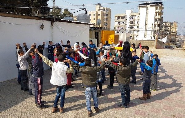Children play outside the social protection centre in Tripoli, one of three centres working to eliminate the 'worst forms of child labour'. [Photo courtesy of the social protection centre in Tripoli]