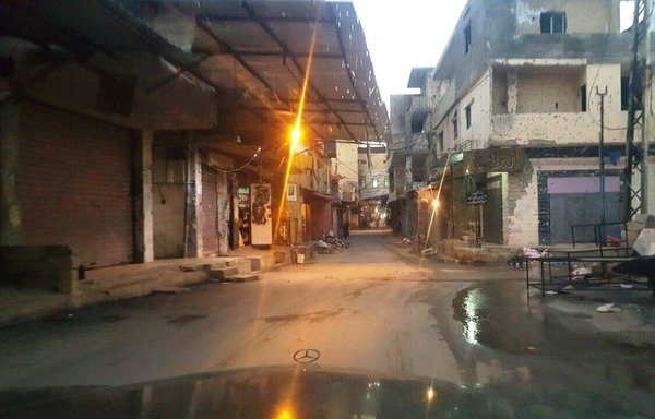 Damage to buildings in Ain al-Hilweh Palestinian refugee camp is seen here after recent clashes have pitted Fatah against extremist groups operating under the auspices of ‘Osbat al-Ansar'. [Photo courtesy of Nazih Naqouzi]