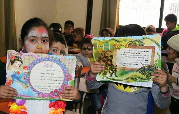 Syrian children participate in an activity at a school that Damma opened in Madaya. [Photo courtesy of Damma]