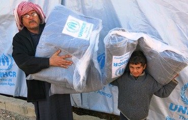 Refugees still confused by new joint aid card