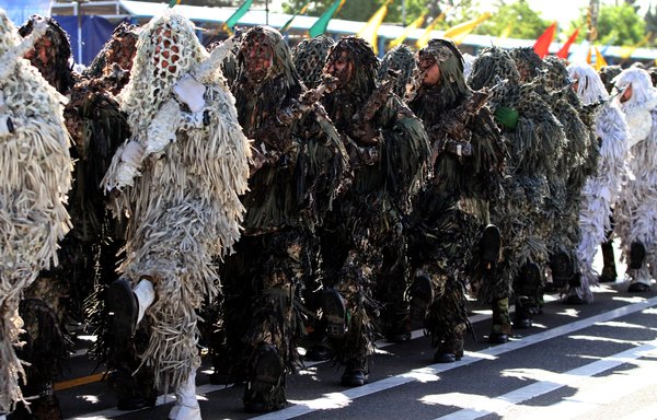 Iranian soldiers march during an April 18th parade in Tehran marking National Army Day. [Atta Kenare/AFP]