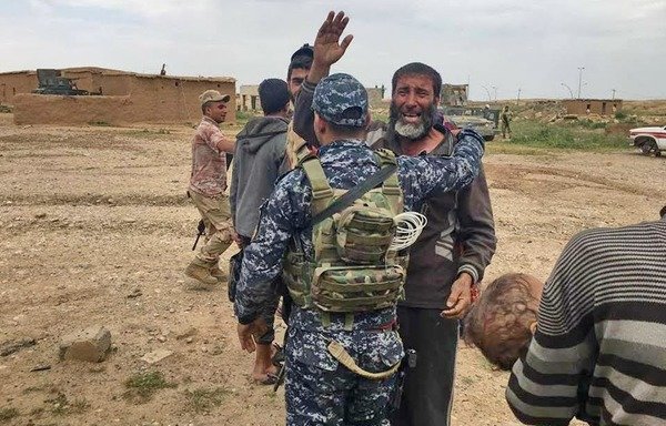 An Iraqi soldier embraces a Mosul resident who had managed to escape the city unharmed despite the 'Islamic State of Iraq and Syria' holding civilians as hostages in the few areas still under its control. [Photo courtesy of the Federal Police Command]