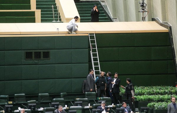 Policemen deploy in the main hall of Iranian parliament on June 7th to protect lawmakers during an 'Islamic State of Iraq and Syria' attack which targeted the complex. [Chavosh Homavandi/AFP]