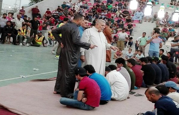 Players and spectators enjoy the traditional game of al-Muhaibis at Baghdad's al-Shaab stadium during Ramadan 2016. [Photo courtesy of Jassim al-Aswad]