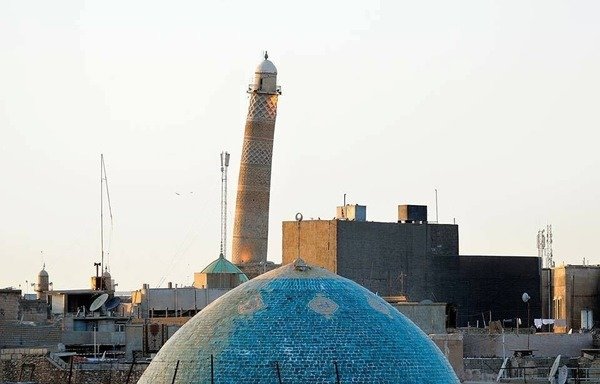 The leaning minaret of Mosul's al-Nuri Mosque, known as al-Hadba (the hunchback) has been a symbol of the city for hundreds of years and appears on Iraq's 10,000-dinar banknote. The 'Islamic State of Iraq and Syria' blew it up on June 21st. [Photo courtesy of Iraqi Military Encyclopedia]