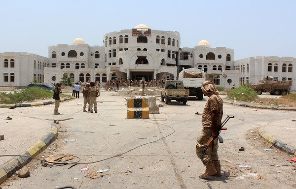 Yemeni government forces walk in Zinjibar on August 16th, 2016 after they entered the capital of the southern Abyan province following an offensive backed by Arab coalition airstrikes to recapture the city from al-Qaeda. [Saleh al-Obeidi/AFP]