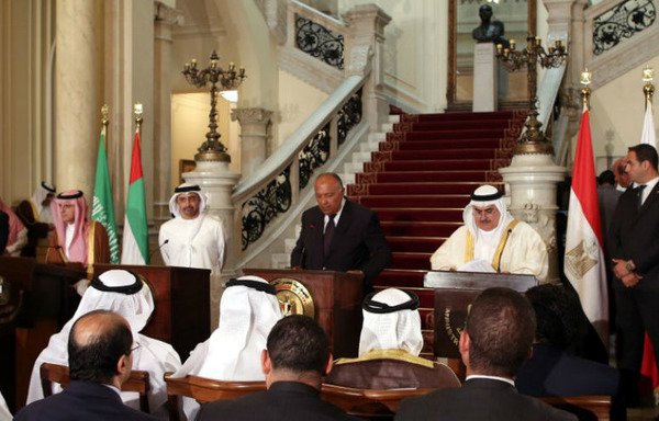 Egyptian Foreign Minister Sameh Shoukry (C) reads a statement while giving a joint press conference with Saudi Foreign Minister Adel al-Jubeir (L), UAE Minister of Foreign Affairs Abdullah bin Zayed Al-Nahyan (2nd-L), and Bahraini Foreign Minister Khalid bin Ahmed al-Khalifa (3rd-R) after their meeting in the Egyptian capital Cairo on July 5th to discuss the Gulf diplomatic crisis with Qatar. [Khaled al-Fiqi/POOL/AFP]