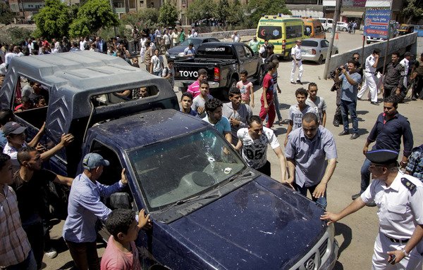 Egyptian police inspect the scene of a shooting which killed five of their colleagues near Badrasheen, a town some 20 kilometres from Cairo, on July 14th. The militant Hasm movement has claimed similar attacks in the area. [Ahmed Abdel-Gawad/AFP]