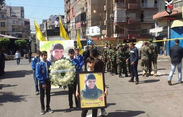 Children from Imam al-Mahdi Scouts attend the funeral procession of Mahdi Hassan Abu Hamdan, a teenager fighting in the ranks of Hizbullah who was killed in Syria.  [Photo via Hizbullah-affiliated Sada al-Shohada Facebook page]