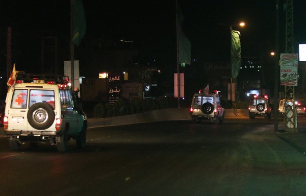 Lebanese Red Cross ambulances carrying human remains believed to belong to eight soldiers kidnapped by the 'Islamic State of Iraq and Syria' three years ago drive through the city of Baalbek on their way to Beirut on August 27th. [STRINGER/AFP]
