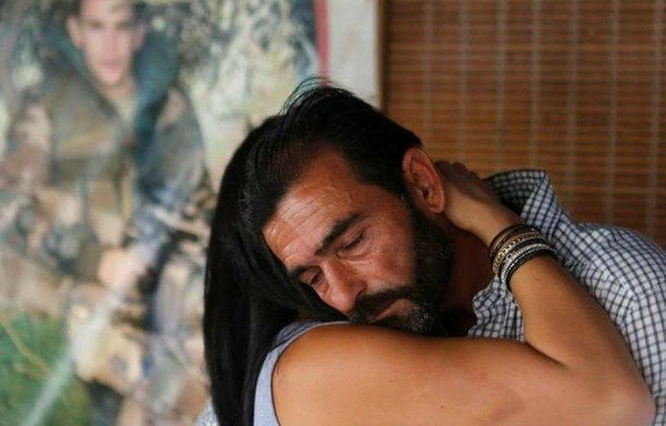 Hussein Yusuf, the father of slain Lebanese soldier Mohammed Yusuf, mourns the death of his son after he received news that the 'Islamic State of Iraq and Syria' has killed him and eight others who were held captive by the group since 2014. [Photo circulated on social media accounts]
