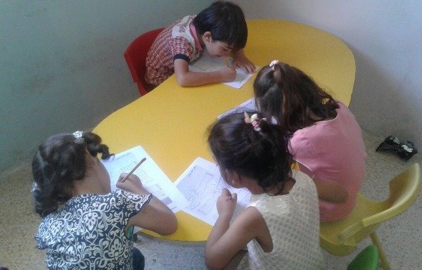 Syrian refugee children take part in a summer learning activity offered by the Damma group. Various summer programmes are helping Syrian and Lebanese students get up to speed ahead of the new school year. [Photo courtesy of Damma]
