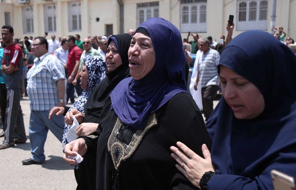 Egyptian women weep at a July 8th funeral north of Cairo for soldiers killed a day earlier in an 'Islamic State of Iraq and Syria' attack in Sinai. ISIS on Wednesday (September 20th) announced it had killed four Sinai tribesmen for collaborating with the Egyptian army. [Mahmoud Bakkar/AFP]