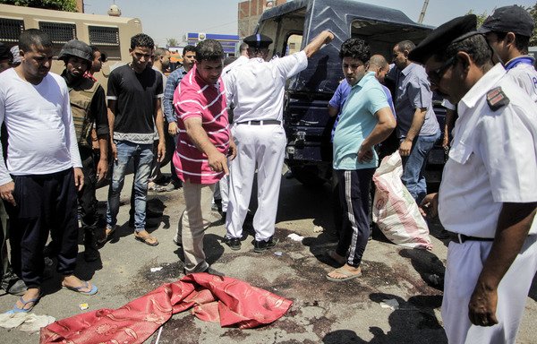 Egyptian police on July 14th inspect the scene of an attack which killed five of their colleagues in Badrasheen on the southern outskirts of Cairo. On October 2nd, police engaged in a shootout with Hasm militants in nearby 15th of May City in Helwan, killing three. [Ahmed Abd el-Gawad/AFP]
