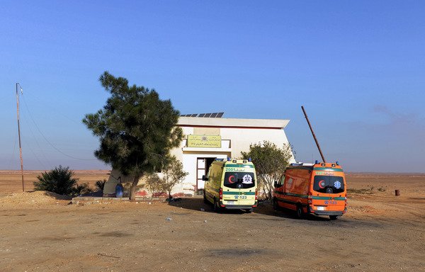 A picture taken on Sunday (October 22nd) shows ambulances parked at a medical emergency station on the desert road leading to the Bahariya Oasis in Egypt's Western desert, at the site of a Friday ambush that killed at least 16 policemen. [Mohamed el-Shahed/AFP]