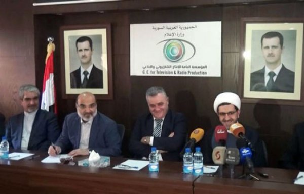 An Iranian delegation led by Islamic Republic of Iran Broadcasting chairman Abdulali Ali Asgari signs a media co-operation agreement with Syrian counterparts during an October visit to Damascus. [Photo circulated on social media]
