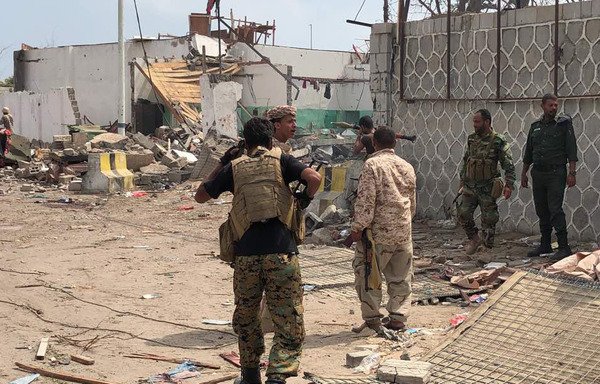 Yemeni men and security forces inspect the site of a suicide bombing in the southern port city of Aden, on November 5th. [Stringer/AFP]