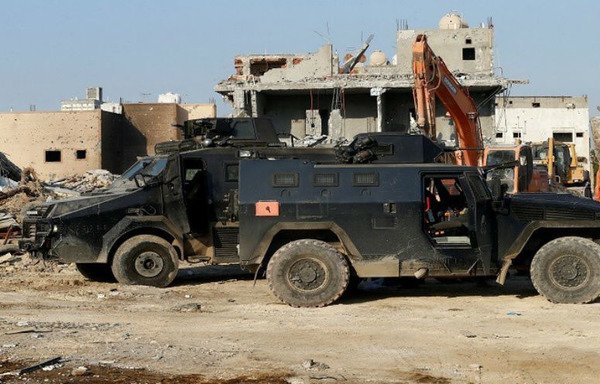 Saudi military vehicles are seen during previous confrontations with elements recruited by Iran's Islamic Revolutionary Guard Corps in al-Awamiyah. [Photo courtesy of Saudi Press Agency]
