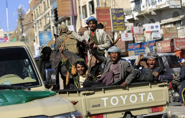 Houthi fighters ride in an armoured vehicle outside the residence of slain former president Ali Abdullah Saleh in Sanaa on December 4th. [Mohammed Huwais/AFP]