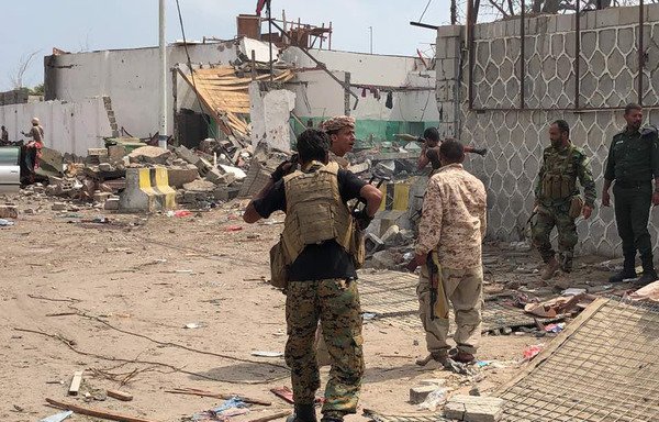 Yemeni men and security forces inspect the site of a suicide bombing in the southern port city of Aden, on November 5th. Security forces in the city have been on high alert since eliminating a terror cell December 12th. [STRINGER/AFP]