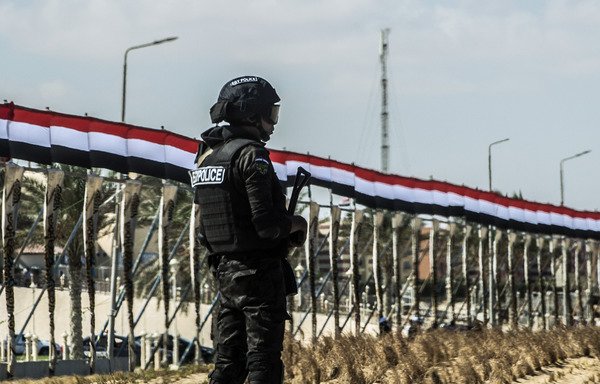 A picture taken on October 21st shows an Egyptian policeman standing guard in the new city of el-Alamien, west of Alexandria. Egyptian forces made a series of terror-related arrests in the Alexandria area on Monday (December 18th). [Khaled Desouki/AFP]