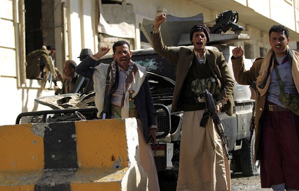 Houthi fighters are seen outside of the residence of Yemen's former President Ali Abdullah Saleh who was killed by the militia as he was fleeing Sanaa on December 4th. [Mohammed Huwais/AFP]