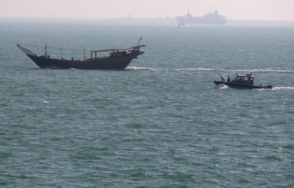A US Navy patrol boat follows a boat that passed near the USS Ponce where then-Secretary of Defence Chuck Hagel was taking a tour, in this file photo from December 6th, 2013 near Manama, Bahrain. [Mark Wilson/Getty Images/AFP]