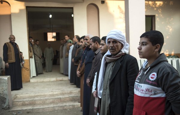 Egyptians attend the November 26th funeral of Fethy Ismail, muezzin of al-Rawda mosque, who died in an 'Islamic State of Iraq and Syria' attack near the North Sinai provincial capital of al-Arish. [Mohamed el-Shahed/AFP]