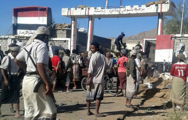 Yemenis gather outside the camp of the 19th Infantry Brigade in Baihan, Shabwa province, after it was seized by al-Qaeda on February 12th, 2015. Shabwa elite forces have been working to oust al-Qaeda remnants from the province. [Stringer/AFP]