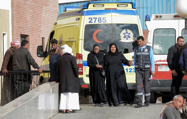 Relatives of the victims of the Rawda mosque attack in North Sinai walk past an ambulance outside the Suez Canal University hospital in Ismailia on November 25th, where the injured were taken to receive treatment. Women in Sinai will continue to stand strong in the face of ISIS threats against them. [Mohamed el-Shahed/AFP]