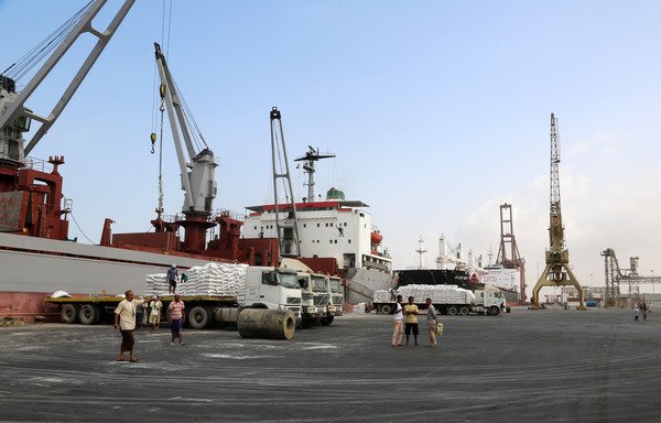 A crane unloads food aid provided by UNICEF from a cargo ship at the Red Sea port of al-Hodeida on January 27th. Al-Hodeida is a key entry point for UN aid to Yemen, though islands off the coast have been used by smugglers. [Abdo Hyder/AFP]