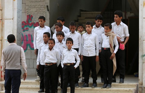 Yemeni children, formerly Houthi fighters, are pictured outside a rehabilitation centre at a school in Yemen's Marib on January 29th. [Abdullah al-Qadry/AFP]
