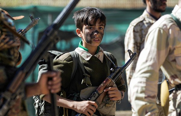 A young Houthi recruit takes part in a gathering in Sanaa to mobilise more fighters to battlefronts on February 2nd, 2017. [Mohammed Huwais/AFP]