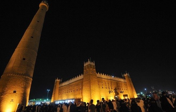 Saudis gather outside al-Qasim pavilion during the 32nd Janadriyah Culture and Heritage Festival, held on the outskirts of the capital Riyadh on February 17th, 2018. Saudi Arabia is planning to spend billions on building new venues and flying in Western acts, in a total overhaul of its entertainment sector. [Fayez Nureldine/AFP]